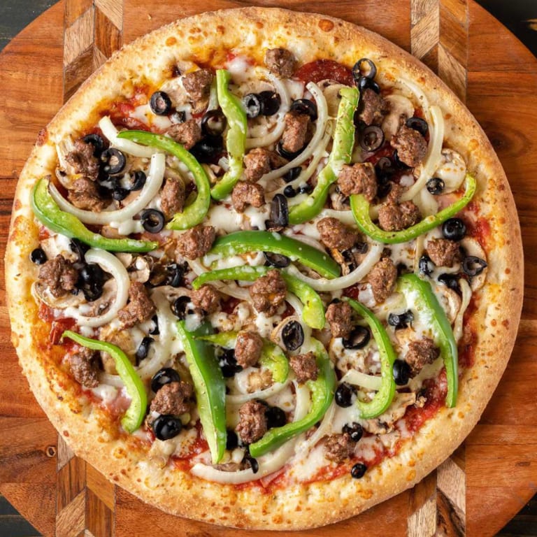 Indulge in Our Deep Dish Pizza